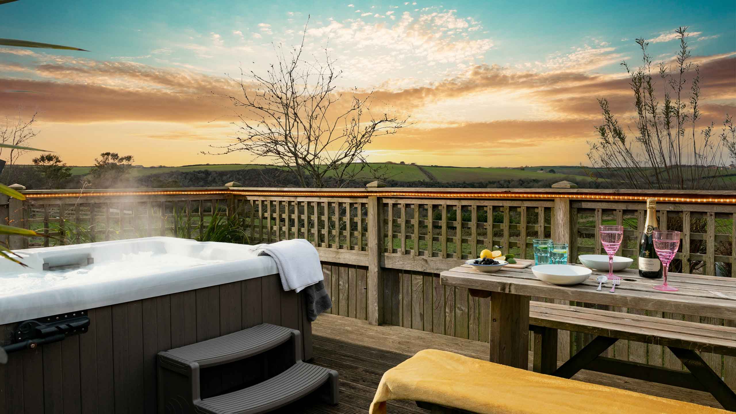 A hot tub and picnic table over looking the rolling countryside