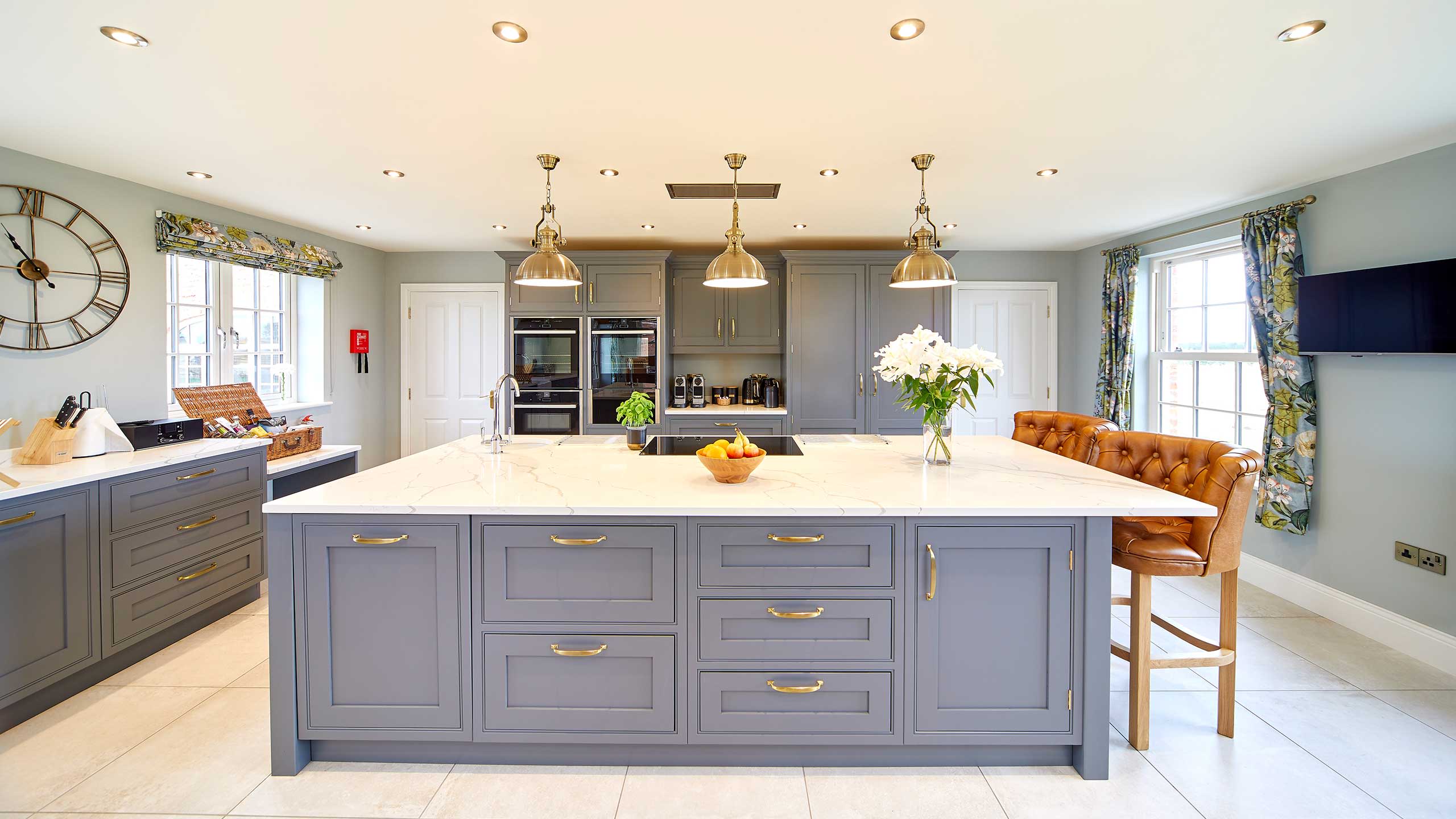 The interior of a farmhouse kitchen with a large island