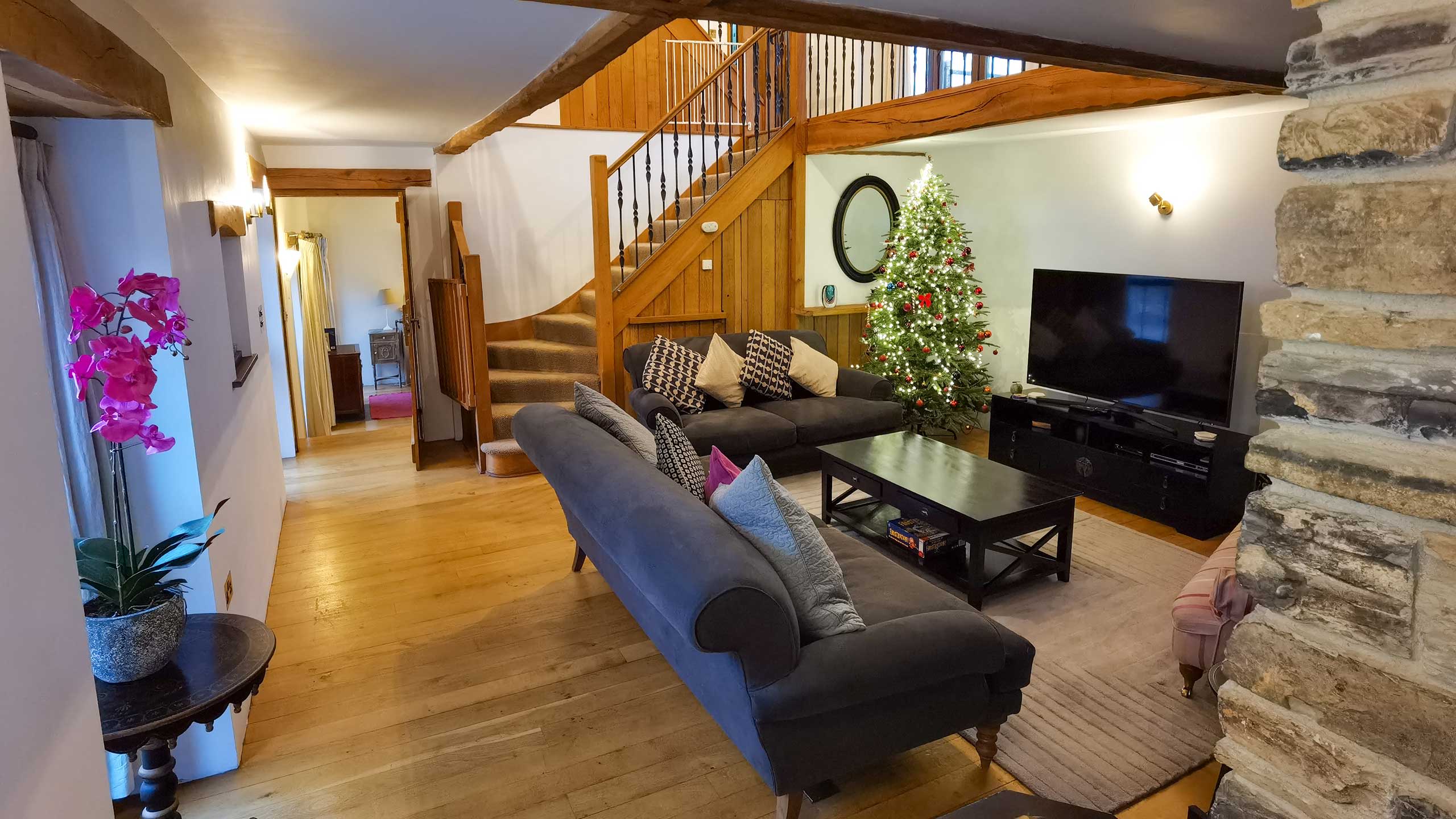 The interior of a cottage, showing the lounge and staircase to the second floor
