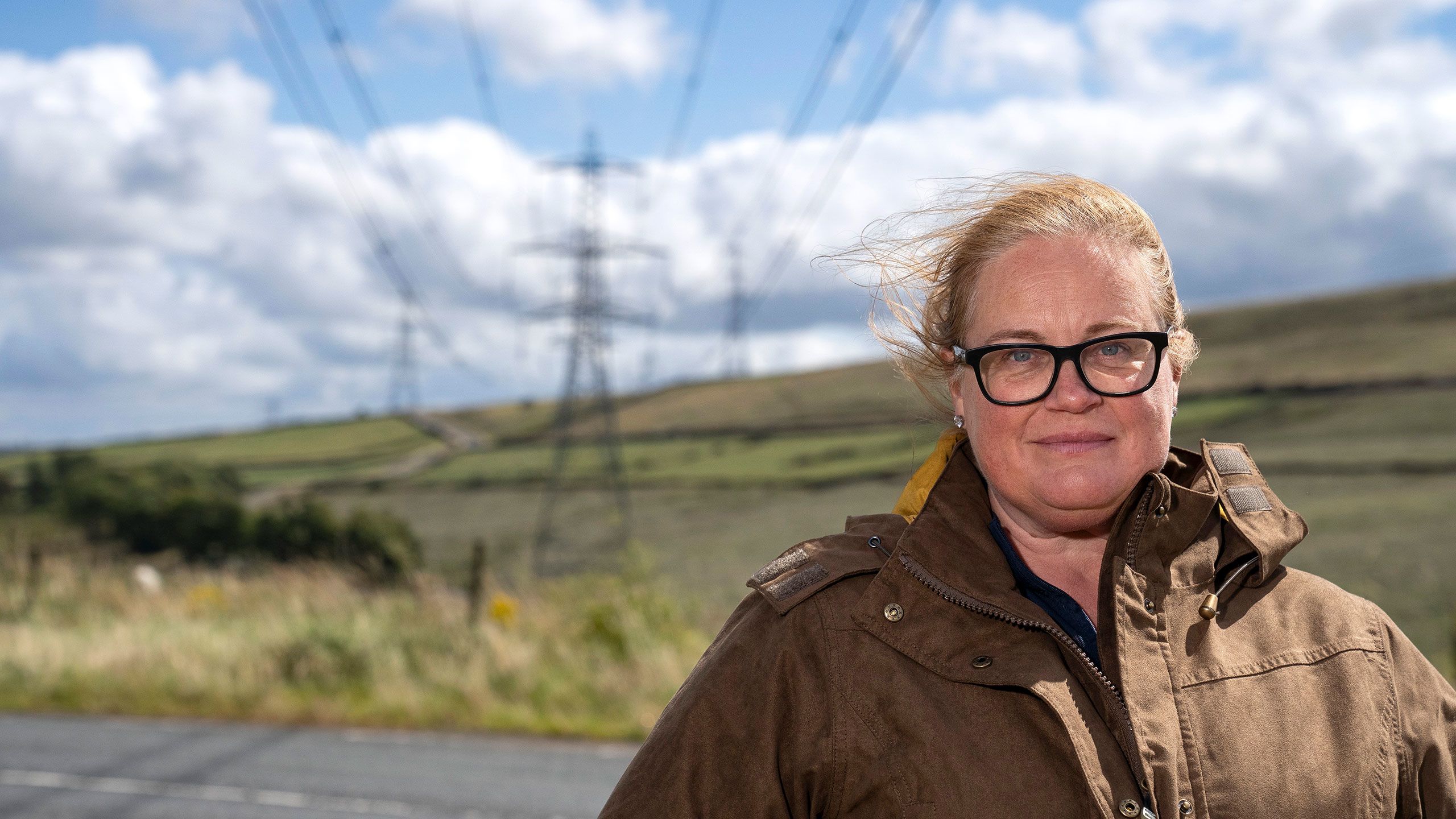 Rachel Hallos stood in front of a pylon