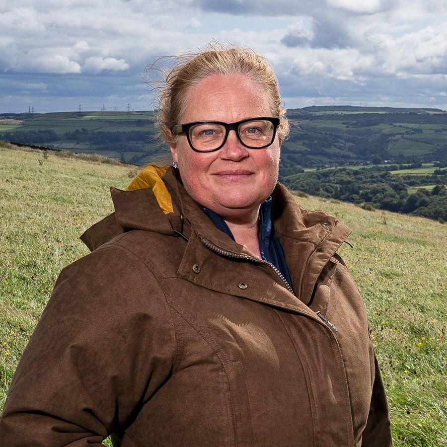 Rachel Hallos stood on her farm